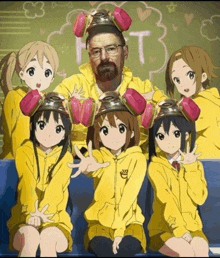 a group of anime girls are posing for a picture with a man wearing a hazmat suit and helmet