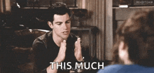 a man is talking to a woman and says " this much "