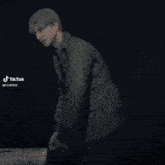 a blurred image of a person 's face with tiktok written on the bottom right