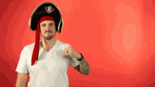 a man wearing a pirate hat and a red bandana