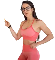 a woman wearing glasses and a pink sports bra holds a pencil