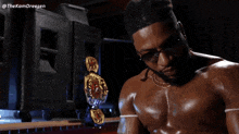 a man without a shirt is standing in front of a boxing ring with the hashtag thekamdreesen