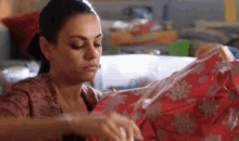 A Bad Moms Christmas Mila Kunis GIF - A Bad Moms Christmas Mila Kunis Wrapping Presents GIFs