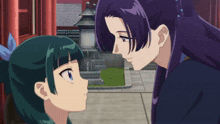 a woman with purple hair and a green haired girl looking at each other