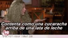 a gif of a woman saying contenta como una cucaracha
