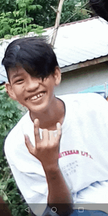 a young boy wearing a white shirt that says u.s.a.
