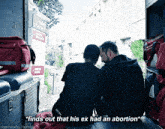two men are sitting in the back of an ambulance with the words " finds out that his ex had an abortion " above them