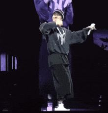 a man in a hoodie with the letter m on it