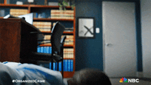 a blurry picture of a room with a nbc logo on the bottom