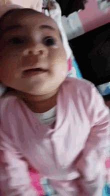 Baby Stare GIF - Baby Stare Laying In Bed GIFs