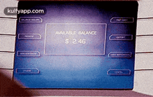 a person is using an atm machine to withdraw money