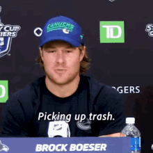 Brock Boeser Picking Up Trash GIF - Brock Boeser Picking Up Trash Vancouver Canucks GIFs