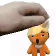 a person is petting a stuffed animal with blonde hair on its head .