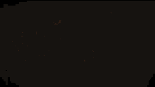 a light shines through a dark background