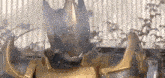 a cat is wearing a samurai armor and smoking a cigarette .