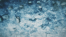 an aerial view of a snowy area with a person standing in the middle
