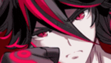 a close up of a person 's face with red and black hair .