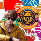 a young man wearing sunglasses and a yellow hoodie with a logo that says tunay na tropa starmaker