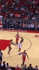 a basketball game between the houston rockets and the heat is underway