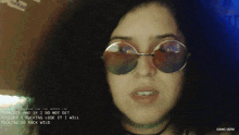 a woman wearing round sunglasses says " trouble and if i do not get rescued i fucking lose it "