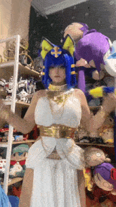a woman in a costume with blue hair and yellow ears
