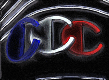 a blue white and red champion logo on a black surface