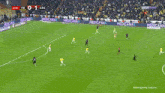 a soccer game is being played and the score is 0-1