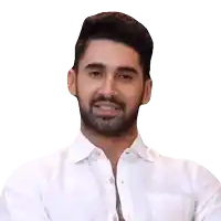 a man with a beard is wearing a white shirt and says " yeah "
