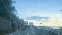 a car is driving down a highway with the letter l on the left