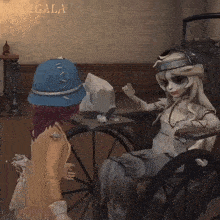 a girl in a blue hat is standing next to a doll in a wheelchair in a room .