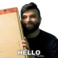 a man with a beard holds a cardboard box that says hello