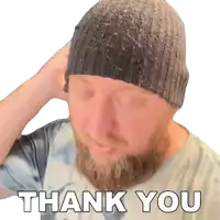 a man with a beard wearing a beanie and a thank you sticker