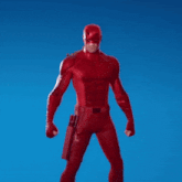 a man in a red superhero costume is waving his hand in the air