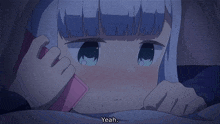 a girl with blue hair is laying in bed with a pink phone and says yeah