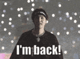 a man wearing a headband with the word supreme on it says " i 'm back "