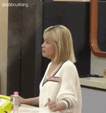 a blonde woman with a name tag that says klarisse on it