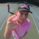 a man wearing a hat that says obey world cup