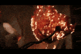 a person is holding a piece of bloody meat