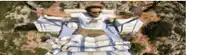 a man is laying on a blanket with his arms outstretched ..