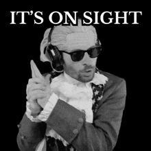 a black and white photo of a man with the words it 's on sight below him