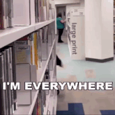 a library with a large print sign in the background