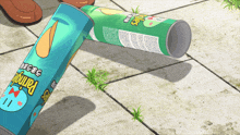 two cans of pringles chips on the ground