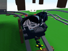 a girl is riding a roller coaster with a cross on the side