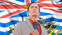 a man in a suit and tie is standing in front of an british flag
