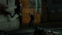 a disney + advertisement shows two men fighting