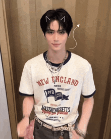 a young man wearing a new england t shirt