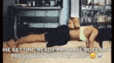 a woman is doing push ups in a room with a cat .