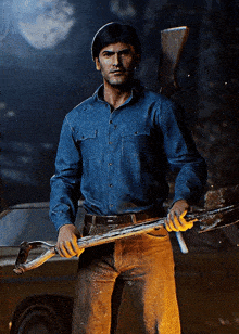 a man in a blue shirt is holding a shovel and a gun