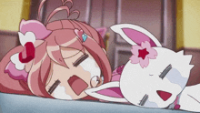 a girl with pink hair is laying next to a white cat with a flower on its head