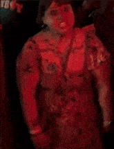 a woman is making a very angry face in a green light